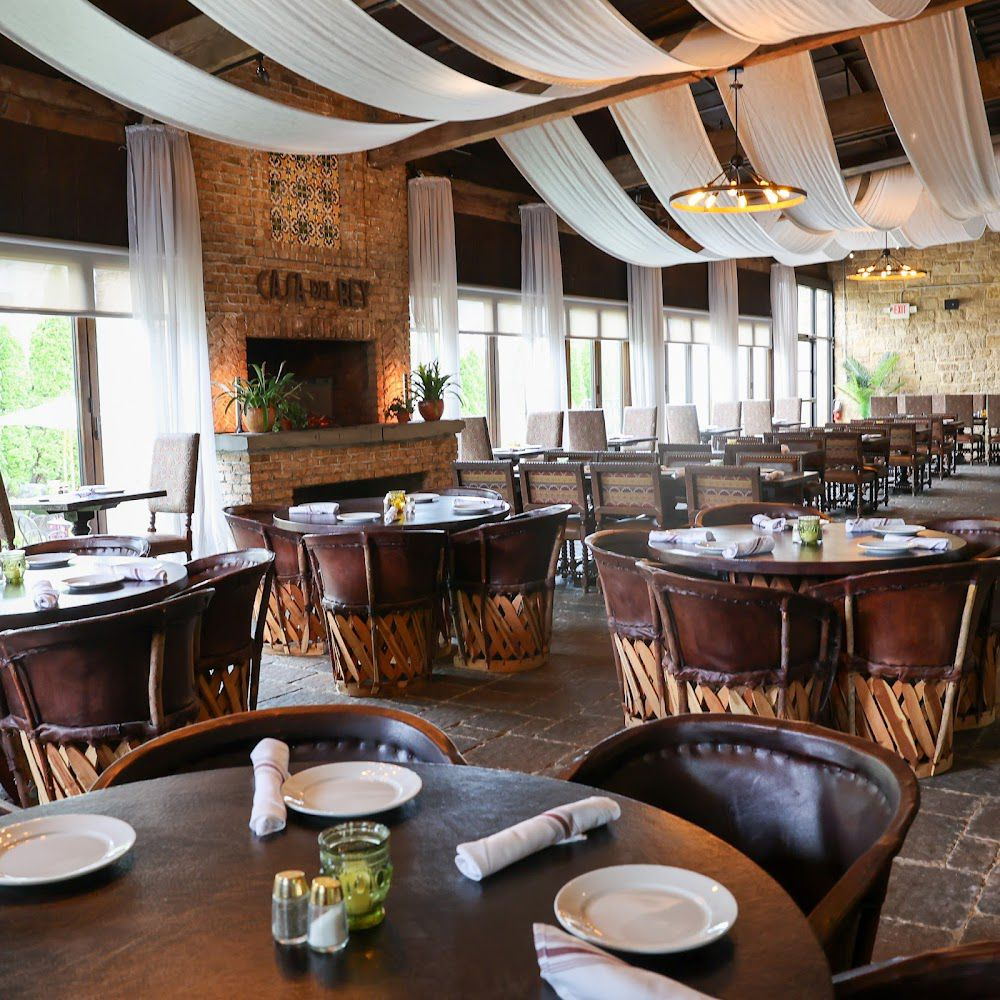 Dining area with fireplace and draped ceiling